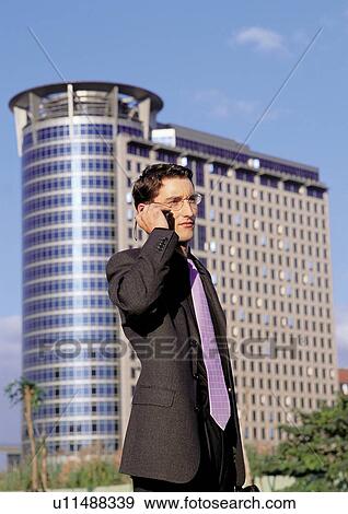 Stock Photo - work, building exterior, waist up. Fotosearch