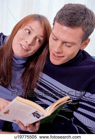 Stock Photography - carefree, leisure activity, affection, book, leaning, indoor. Fotosearch