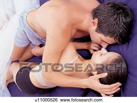 Couple in bed View Large Photo Image Stock Photograph - Couple in bed. Fotosearch