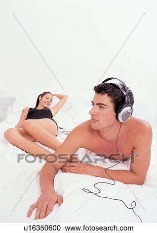 Stock Image - couples, indoor, young adult. Fotosearch