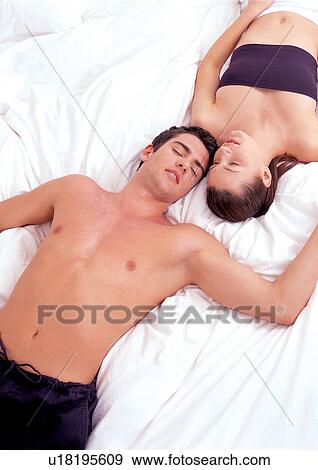 Stock Photo - couples, indoor, young adult. Fotosearch