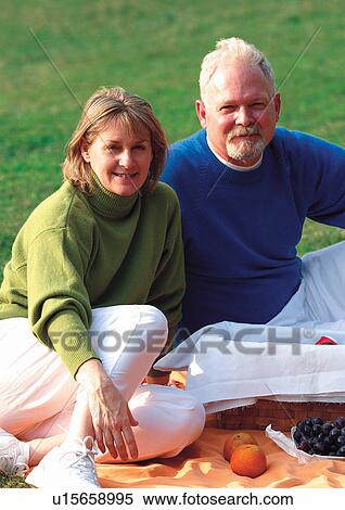 Stock Photography - couples, sitting, outdoor. Fotosearch