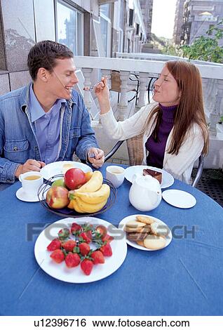 couples, two people, toothy smile, head and shoulders, casual clothing, feeding View Large Photo Image Stock Photograph - couples, two people, toothy smile, head and shoulders, casual clothing, feeding. Fotosearch