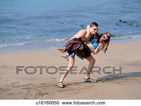 mid adult man, sunlight, day, carefree, standing View Large Photo Image Stock Image - mid adult man, sunlight, day, carefree, standing. Fotosearch