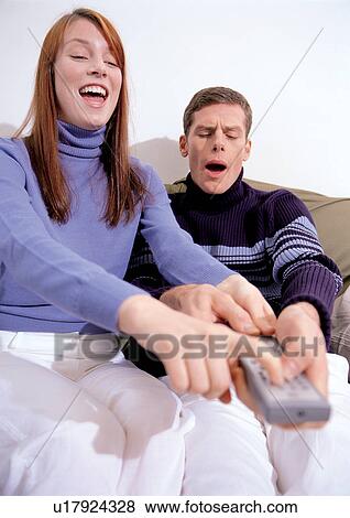 Stock Photo - mid adult woman, carefree, holding, mid adult man, lifestyle, couples. Fotosearch