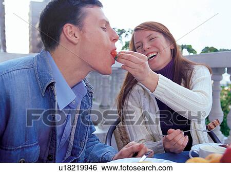 Stock Photograph - outdoor, lifestyle, casual clothing, mid adult man, smiling, partner. Fotosearch