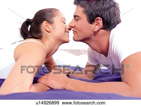 relaxation, emotion, lying down, toothy smile, holding hands View Large Photo Image Stock Photo - relaxation, emotion, lying down, toothy smile, holding hands. Fotosearch