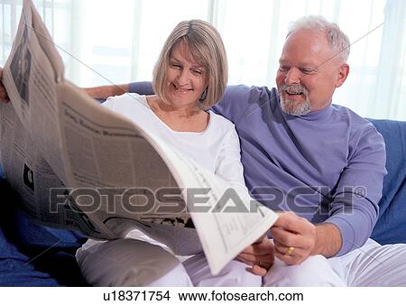 senior adult, senior man, sitting, newspaper, romance, smiling View Large Photo Image Picture - senior adult, senior man, sitting, newspaper, romance, smiling. Fotosearch