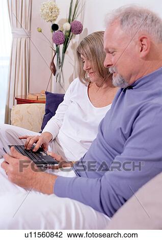 Stock Image - side by side, love, emotion, arms around, mate, senior woman, quarter length. Fotosearch