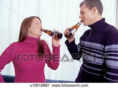 Stock Photo - two people, carefree, mid adult woman, casual clothing, love, affection. Fotosearch