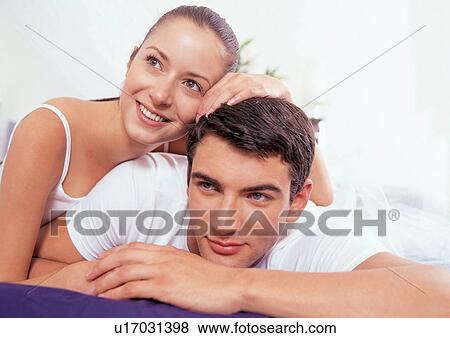 young woman, lying down, carefree, leaning, young adult, affection View Large Photo Image Stock Photo - young woman, lying down, carefree, leaning, young adult, affection. Fotosearch