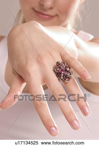 Stock Photography - Close-up of a ring on a young woman's hand. Fotosearch