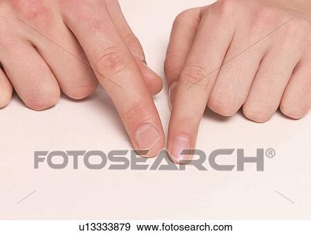 Close-up of a young couple's index fingers View Large Photo Image Stock Photo - Close-up of a young couple's index fingers. Fotosearch