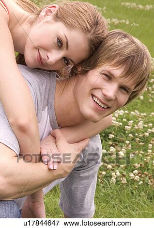 Portrait of a young couple smiling View Large Photo Image Stock Photo - Portrait of a young couple smiling. Fotosearch