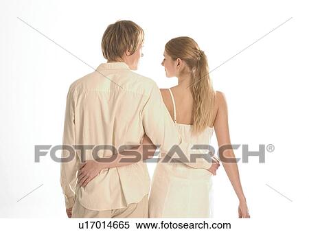 Rear view of a young couple View Large Photo Image Stock Photography - Rear view of a young couple. Fotosearch