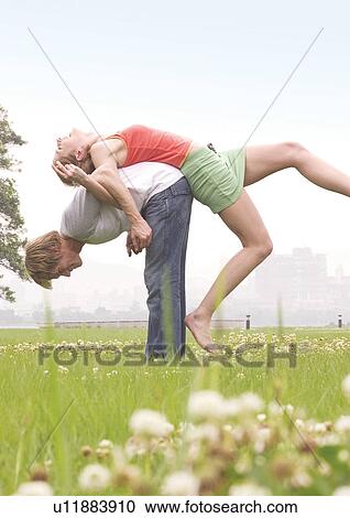Side profile of a young man lifting a young woman on his back View Large Photo Image Stock Image - Side profile of a young man lifting a young woman on his back. Fotosearch