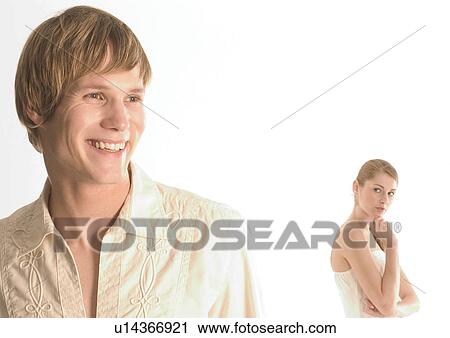 Young woman standing behind a young man View Large Photo Image Stock Image - Young woman standing behind a young man. Fotosearch
