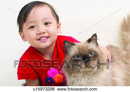 Stock Photo - Cat, Animal Themes, Casual Clothing, Brown Hair, Asian Ethnicity, Child, 3-4 Years. Fotosearch