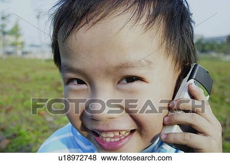 Stock Photo - Close-Up, Asian Ethnicity, Child, Casual Clothing, Brown Hair, 4-5 Years. Fotosearch