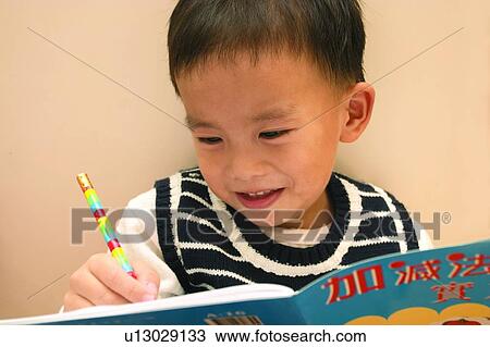 Stock Image - East, Kids Life, One Person, Notebook, Close-Up. Fotosearch