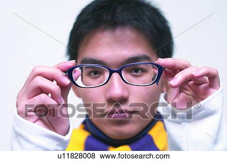 Stock Photo - Human Hand, Holding, Tween, Portrait, White Background, Childhood, Looking At Camera. Fotosearch