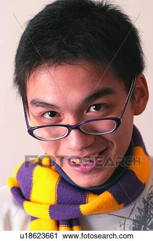Stock Image - Indoor, Smiling, Confidence, Black Hair, One Boy Only, One Child Only. Fotosearch
