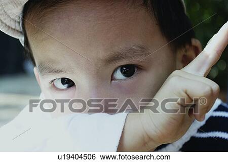 Stock Photograph - Looking At Camera, Close-Up, One Boy Only, Eastern, One Person. Fotosearch