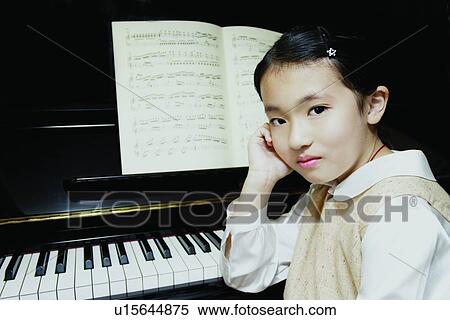 One Child Only, Lifestyles, One Person, Musical Instrument, Innocence, Asian Ethnicity View Large Photo Image Stock Photography - One Child Only, Lifestyles, One Person, Musical Instrument, Innocence, Asian Ethnicity. Fotosearch