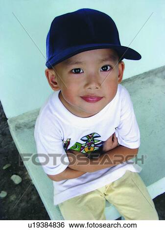 Stock Photograph - Outdoor, Asian Ethnicity, Portrait, Eastern, Arms Crossed, Waist-Up, Casual Clothing. Fotosearch