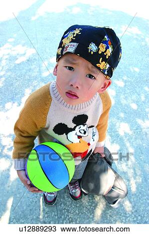Stock Image - Standing, Elementary Age, Child, Lifestyles. Fotosearch