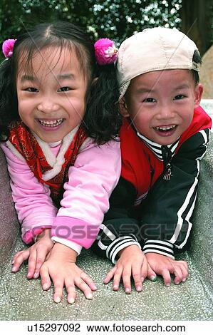 Togetherness, Sibling, Toothy Smile, Day, Close-Up View Large Photo Image Stock Image - Togetherness, Sibling, Toothy Smile, Day, Close-Up. Fotosearch
