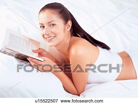 Stock Photo - bed, bedding, bedroom, book. Fotosearch