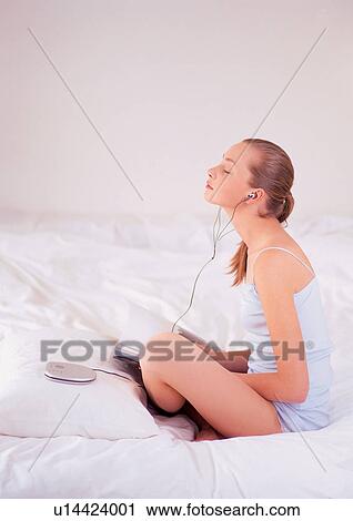 Stock Image - bed, bedding, bedroom, brown hair. Fotosearch