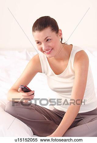 Stock Photography - bed, bedroom, brown hair. Fotosearch