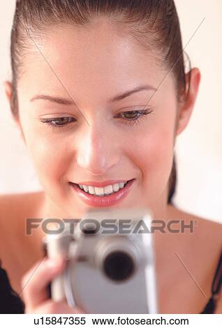 Stock Photography - brown hair, camera, cheerful. Fotosearch