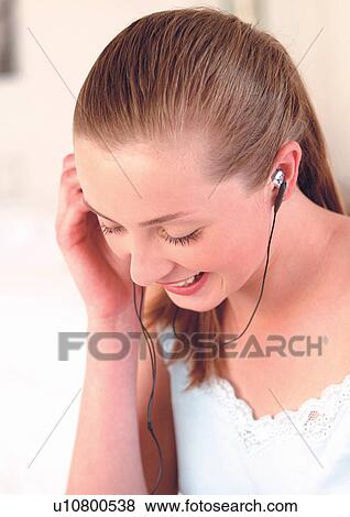 Stock Photo - brown hair, close-up, content. Fotosearch