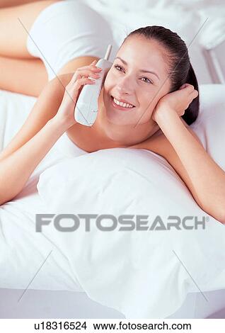 brown hair, smiling, leisure, cordless, looking up View Large Photo Image Picture - brown hair, smiling, leisure, cordless, looking up. Fotosearch