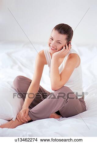 cellular, smiling, cushion, pillow, sole, mobile phone View Large Photo Image Picture - cellular, smiling, cushion, pillow, sole, mobile phone. Fotosearch