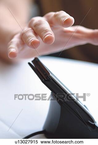 Stock Photography - device, gadget, single, brown hair, wire, young. Fotosearch