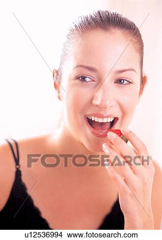 eating, edible, night dress, leisure new generation, looking sideways, happiness View Large Photo Image Picture - eating, edible, night dress, leisure new generation, looking sideways, happiness. Fotosearch