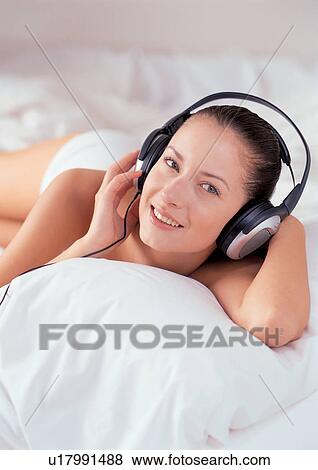 Stock Photo - enjoyment, joy, one person, gadget, cheerful, phones. Fotosearch