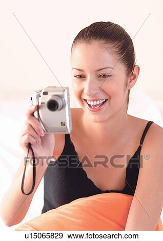 Stock Photo - happy, indoor, new generation, single, leisure, young woman. Fotosearch