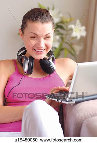 Stock Image - happy, toothy smile, single, sitting, leisure new generation. Fotosearch