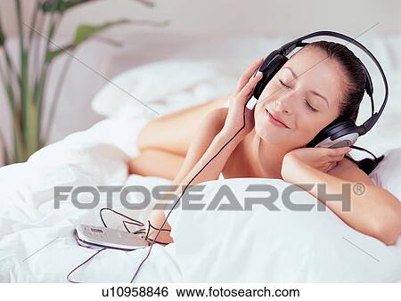 indoor, pillow, enjoyment, bedroom, earphones, relaxing, duvet View Large Photo Image Stock Photograph - indoor, pillow, enjoyment, bedroom, earphones, relaxing, duvet. Fotosearch