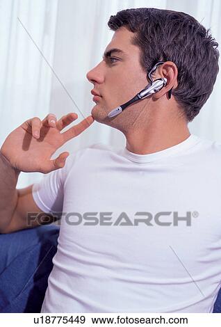 Stock Photo - new generation, single, t-shirt, looking sideways, wearing, indoor. Fotosearch