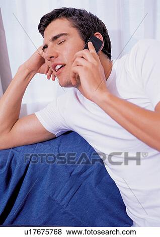 new generation, young man, gadget, cell phone, listening, young View Large Photo Image Stock Photo - new generation, young man, gadget, cell phone, listening, young. Fotosearch