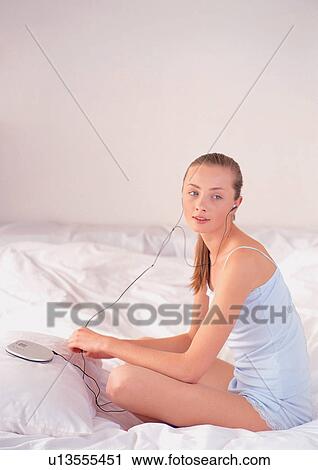 night dress, bedding, night-robe, new generation, sitting, duvet, headphone View Large Photo Image Stock Image - night dress, bedding, night-robe, new generation, sitting, duvet, headphone. Fotosearch