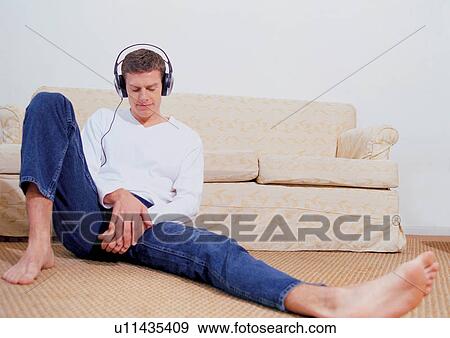sole, home interior, sitting, sofa, earphone, relaxing View Large Photo Image Stock Photo - sole, home interior, sitting, sofa, earphone, relaxing. Fotosearch