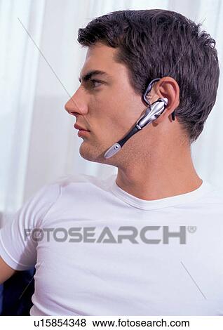 Stock Photo - young man, brown hair, youthful. Fotosearch