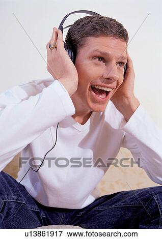 young man, casual clothing, happiness, brown hair, sole View Large Photo Image Stock Photo - young man, casual clothing, happiness, brown hair, sole. Fotosearch